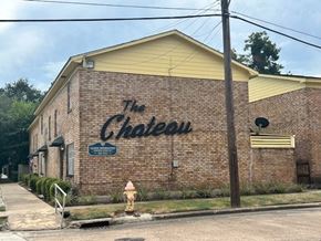 Bay City apartment for rent - A brick building with a sign that says "The Chateau".