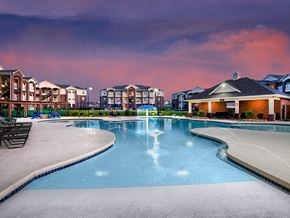 Lawrence apartment for rent - a large swimming pool with apartments in the background