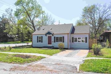 Lawrence apartment for rent - A small house with a red door and a grey roof.