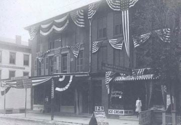 New Brunswick apartment for rent - A black and white photo of a building with an ice cream shop on the ground floor.
