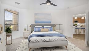Phoenix apartment for rent - a bedroom with a bed and a ceiling fan