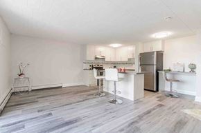 Niagara Falls apartment for rent - a kitchen with a counter top and a refrigerator