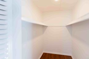 Brookhaven apartment for rent - A long, narrow hallway with white walls and wooden flooring.