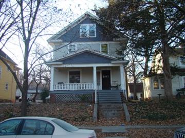 Lawrence apartment for rent - A house with a white car parked in front.