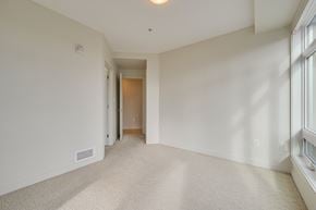 Edmonton apartment for rent - a living room with white walls and a large window