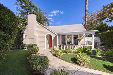 West Hollywood apartment for rent - a small white house with a red front door and a yard with a walkway