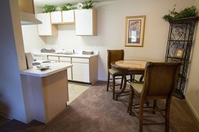 Boiling Springs apartment for rent - A kitchen with a table and chairs in the middle of the room.
