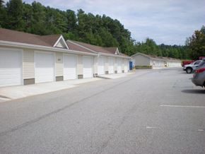 Boiling Springs apartment for rent - A parking lot with a few cars and a building in the background.