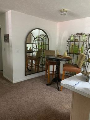 Anderson apartment for rent - A dining room with a table and chairs.