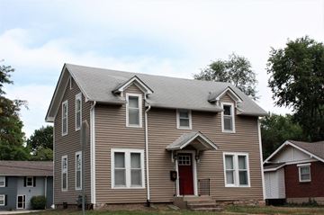 Lawrence apartment for rent - A house with a red door and a grey roof.