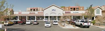 Albuquerque apartment for rent - A parking lot in front of a store with cars parked.