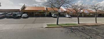 Albuquerque apartment for rent - A parking lot with a building in the background.