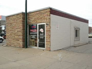 Fremont apartment for rent - A small building with a brick and concrete exterior has a sign that says "Café".