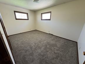 Fremont apartment for rent - A room with carpeted floor and two windows.