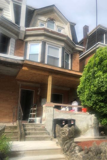 Philadelphia apartment for rent - the front of a house being remodeled with scaffolding