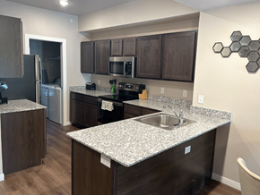 Fayetteville apartment for rent - a kitchen with a granite counter top and a sink