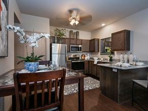 Yukon apartment for rent - a kitchen and dining room with a table and chairs