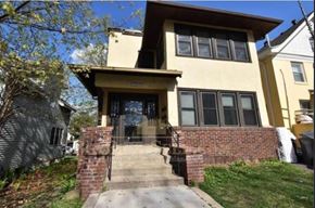 Minneapolis apartment for rent - A house with a brick staircase leading to the front door.