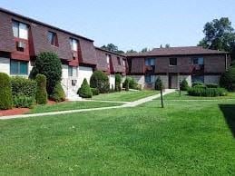 Poughkeepsie apartment for rent - a large yard in front of some houses