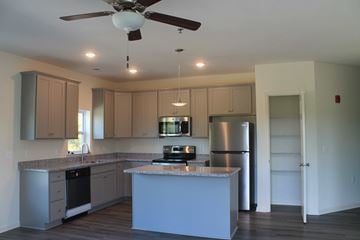 Winchester apartment for rent - a kitchen with white cabinets and a counter top