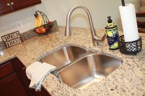 Winchester apartment for rent - a kitchen sink with a chrome faucet in a granite counter top