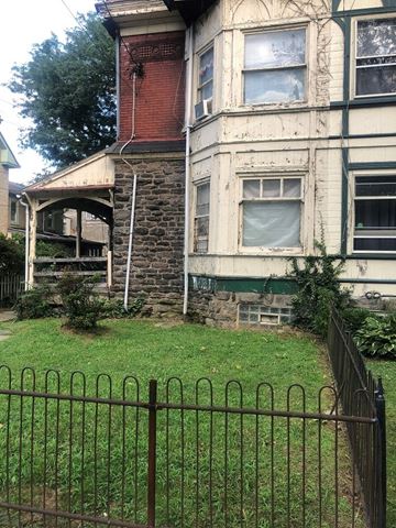 Philadelphia apartment for rent - an old house with a yard and a fence