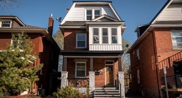 Ottawa apartment for rent - the front of a brick house with a white roof