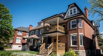 Ottawa apartment for rent - a row of houses with stairs and a porch