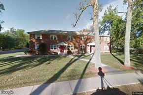 Middletown apartment for rent - a red brick house with a yard and trees
