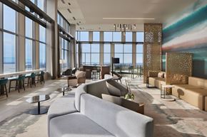 Seattle apartment for rent - 40th level sky lounge with plush seating, co-working spaces and sweeping views