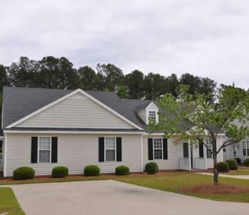 Rocky Mount apartment for rent - A white house with black shutters and a grey roof.