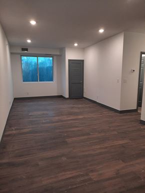 Saint Paul apartment for rent - an empty living room with a door and a window