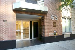 Brooklyn apartment for rent - a brick building with a door and a number on it