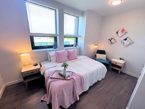 Jasper apartment for rent - a bedroom with a bed and two windows