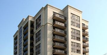 Thornhill apartment for rent - a tall building with balconies and a blue sky