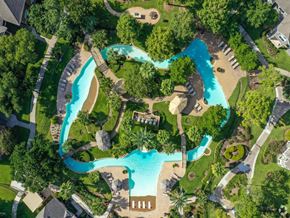 Houston apartment for rent - a resort with a swimming pool and a hotel with trees