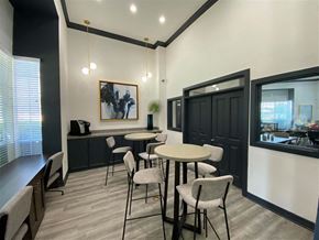 Houston apartment for rent - a dining room with tables and chairs and a window