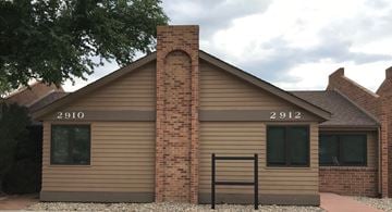 Colorado Springs apartment for rent - A house with the numbers 2910 and 2912 on the front.