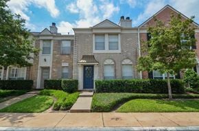 Sugar Land apartment for rent - A row of houses with a blue door in the front.
