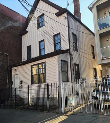 Elizabeth apartment for rent - a white house with a fence in front of it