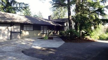 Tigard house for rent - a house with a driveway in front of it