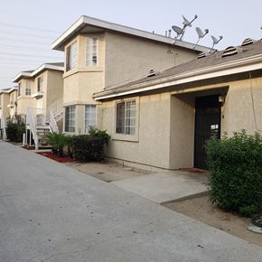 Long Beach apartment for rent - a sidewalk in front of a building with stairs