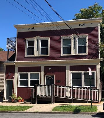 Montclair apartment for rent - a red house with a white porch and a street sign