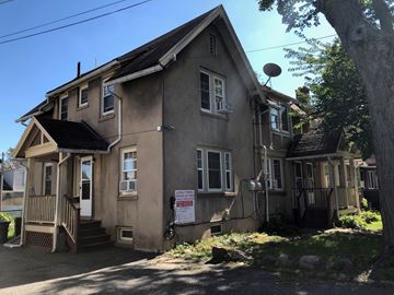 Montclair apartment for rent - an old house with a sign in front of it