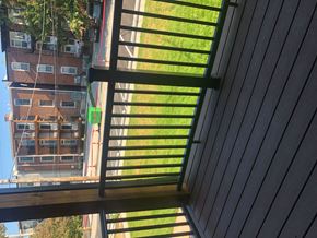 Saint Louis apartment for rent - A view from a balcony looking down at a building.