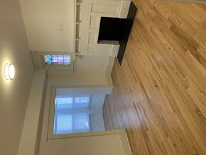 Saint Louis apartment for rent - A staircase with wooden flooring and a skylight above.