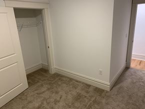 Saint Louis apartment for rent - A room with a carpeted floor and a white door.