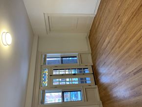 Saint Louis apartment for rent - A wooden ceiling with a light on the left and a window in the middle.