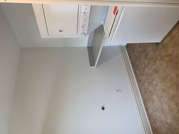 Saint Louis apartment for rent - A white refrigerator with a red handle is in a kitchen.