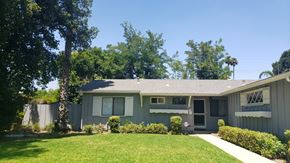 West Hills apartment for rent - A house with a grey roof and a white fence.